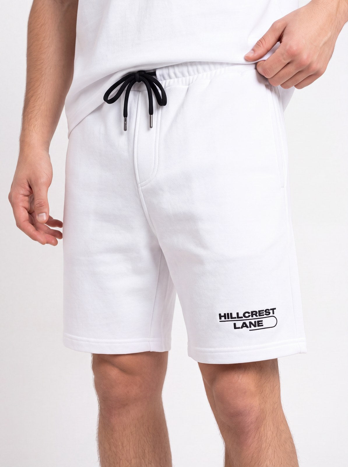 HILLCREST LANE TNU Shorts — White, fully embroidered streetwear shorts